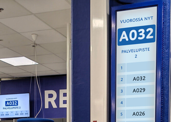 FirstQueue queue management ticket display at a pharmacy prescription counter
